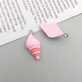 Detail of pink resin flower bear pendants with metal rings for DIY handmade accessories - Pink Resin Conch