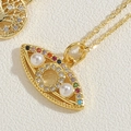 Macro shot of evil eye pendant with pearls and multi-colored zircons on gold chain - Eye Shape Colorful Zircon XL2440-6
