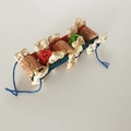 Detailed shot of bird toy with natural grass, corn cobs, wooden blocks, and rattan balls - Natural Corn Cob Colorful Piece Style / Bag Packaging
