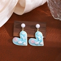 Detailed close-up of heart-shaped floral drop earring with pearls and pink flowers - E7752/Heart Butterfly Rose Earrings