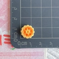 Detailed scale view of a miniature 1.5cm orange round bread cookie resin accessory - Seven Round Hole Biscuit