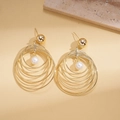Macro detail of layered 18K gold-plated textured hoops with a central teardrop pearl - Silver Needle - Gold (Multi-layer Hoop)