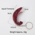 Realistic PVC squid tentacle keychain charm in red with detailed suction cups - Keychain style / Raw Squid Tentacle