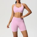 Pink halter sports bra and high-waisted ribbed yoga shorts set for fitness and training - XS / Barbie Pink