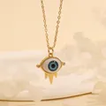 Macro detail of Evil Eye pendant necklace with 18K gold plating and blue resin eye - Blue White Eye-A2