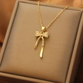 Elegant gold titanium steel necklace with a glittering zircon bow pendant in macro view - Tassel Bowknot Necklace (XL1481-5)
