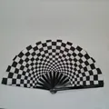 Detail shot of a black and white checkerboard folding fan with black bamboo ribs - Black and White Checkerboard A3