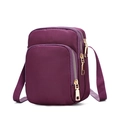Detailed side view of dark purple nylon crossbody bag with three zipper pockets - Purple