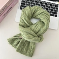 Detailed close-up of moss green ribbed knit texture on a soft wool-like winter scarf - Grass Green