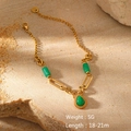 Detailed shot of gold link bracelet featuring green heart and teardrop stone pendants - Green Water Drop Pendant