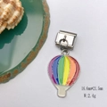 Rainbow hot air balloon charm in colorful enamel on textured background with sea shell - Model 132-Hot Air Balloon