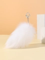 Close-up of a fluffy white faux fur fox tail keychain with silver metal ring attachment - Pure White