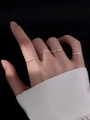 Detailed view of four minimalist silver stainless steel rings worn on female fingers - Adjustable Open / Silver (SE3408)