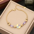 Bracelet œil maléfique doré en acier inoxydable avec charmes en émail sur boîte beige - Style Mauvais Œil Bleu et Violet (3#)