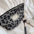 Detail of vintage leopard print corduroy makeup bag with zipper and logo label - Grey Leopard Print