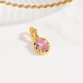 Close-up of golden turtle pendant with oval pink gemstone and 18k gold plating details - Oval Cut Gemstone Pendant / Pink (Oval Style)