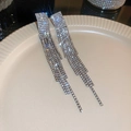 Macro shot of sparkling silver tassel earrings with rhinestones on a ceramic tray - Silver Post Rhinestone Tassel (22#)