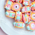 Macro detail of colorful heart-patterned resin beads in a decorative ceramic plate - White Bead + Orange Pink Cream + Heart