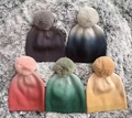 Detailed knit texture of ombre winter beanies with soft faux fur pom poms and ribbed cuffs - Multicolor Mixed