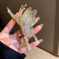 Pince à cheveux papillon dorée avec strass en cristal pour coiffures élégantes - Pince à Cheveux Papillon en Strass
