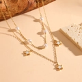 Detail of gold double-layer necklace with white pearl beads and star charm pendant - Gold Star White Shell Necklace (C221)