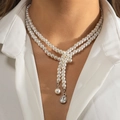 Double-layered pearl necklace with Y-shaped droplet rhinestone pendant on a model - Silver Drop Pendant Necklace