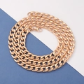Close-up of golden stainless steel Cuban link chain necklace with a lobster clasp - 55cm / Rose Gold