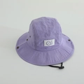 Detail view of purple kids sun hat showing breathable metal eyelet and GO fabric patch - 52cm / Purple