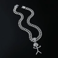 Macro shot of a silver Cuban chain with a diamond-encrusted smiling stickman pendant - Silver (Cartoon Character) - With 5525 50cm Cuban Chain