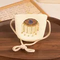 Creamy white woven straw mini crossbody bag with evil eye crystal decor and gold tassel - Kids / Cream