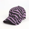 Close-up of baseball cap featuring purple zebra animal print and curved brim detail - Adjustable / Purple Zebra