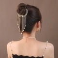 Elegante fermaglio per capelli in metallo dorato con perle e nappe a catena per lo chignon - Nappa di Perle Dorate