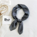 Elegant grey paisley and houndstooth silk scarf tied in a stylish knot for women - Grey Paisley Spot Pattern