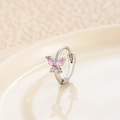 Silver butterfly hoop earring featuring pink marquise-cut gems on a beige plate - Silver Pink (Single)