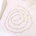 Macro detail of a gold thin chain necklace with transparent teardrop zircon pendants - Clear Teardrop Zirconia Chain (Style 23) / Length approx. 1m