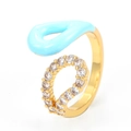 Detail of 18K gold ring with light blue enamel and micro-set zirconia on open band - Blue