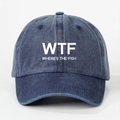 Detailed close-up of washed blue denim baseball cap featuring white WTF FISH print - Navy Blue
