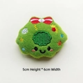 Detail of green embroidered plush charm with cartoon face and stars for DIY crafts - Christmas Wreath