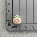 Detailed scale measurement of mini resin cake roll showing the small 1.5cm size clearly - Cake