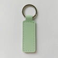 Light green PU leather keychain with silver metal ring and rectangular stitched detail - Mint Green