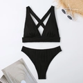 Detail of black ribbed fabric high waist bikini with cross back straps and summer accessories - S / Black