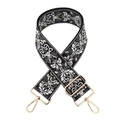 Close-up of ethnic jacquard wide shoulder strap with floral pattern and gold metal buckles - Black and Gray / Gold Buckle