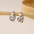 Detail of silver petal-shaped earrings with micro-set zircons on a wooden display - Five-petal Flower Pavé Zirconia Earrings-Silver