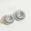 Modern silver titanium steel hoop earrings with textured spiral design and snap closure - Threaded Hollow Earrings Steel Color