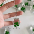 Natural four leaf clover keychain with green dried flower resin rectangle pendant - Square Clover / Keychain