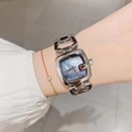 Detail of silver square watch with blue mother-of-pearl dial on woman wrist - Silver Band Black Dial