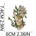 Macro shot of hand and botanical embroidery patch showing detailed size dimensions - Hand Holding Plant