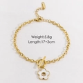 Detail of white shell flower pendant on gold stainless steel bracelet with OT toggle clasp - Style 5 (White Shell Flower OT Buckle)