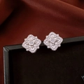 Macro shot of vintage silver rhodium-plated flower earrings with shimmering cubic zirconia - Silver