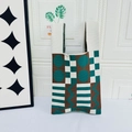 Knitted tote bag with teal and coffee geometric patchwork patterns for daily commute - White Background With Green Polka Dots